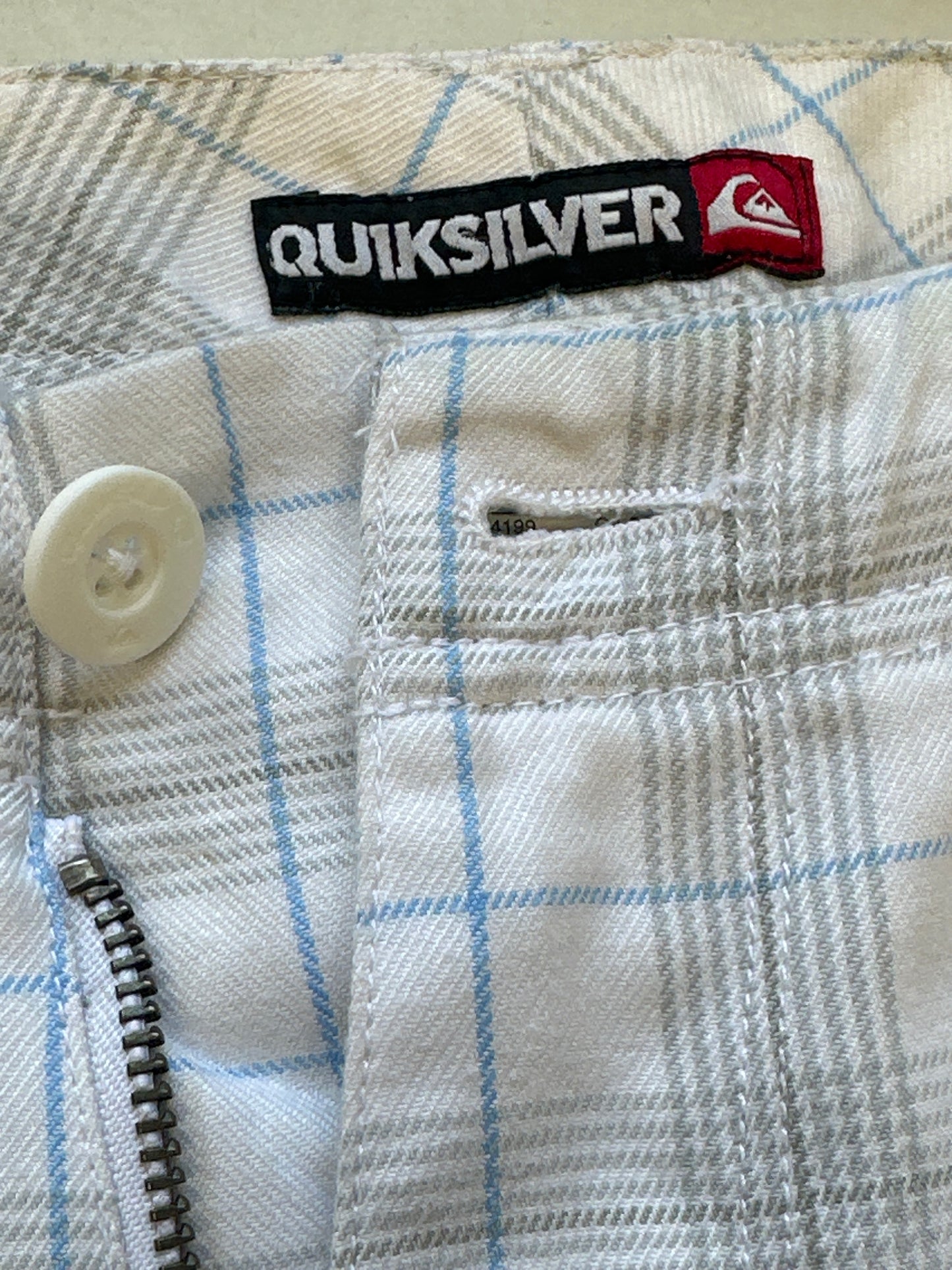 white checkered quiksilver long shorts