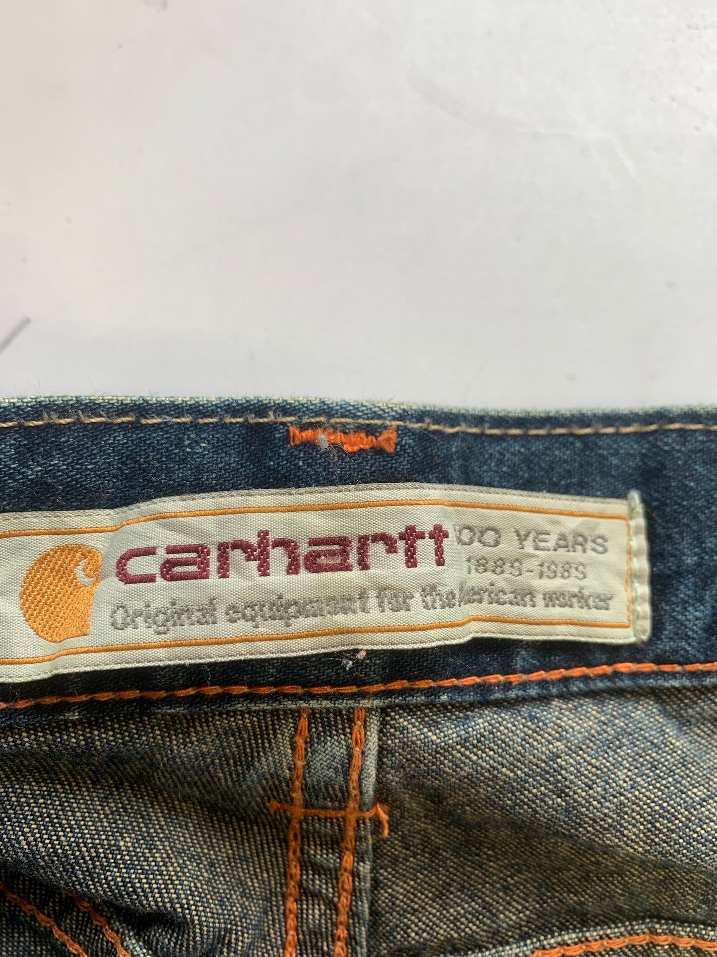 Carhartt dark wash denim cargo jeans