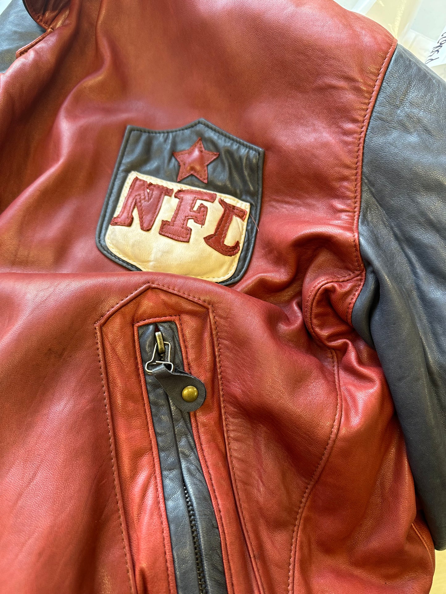 vintage NFL red and black leather bomber jacket