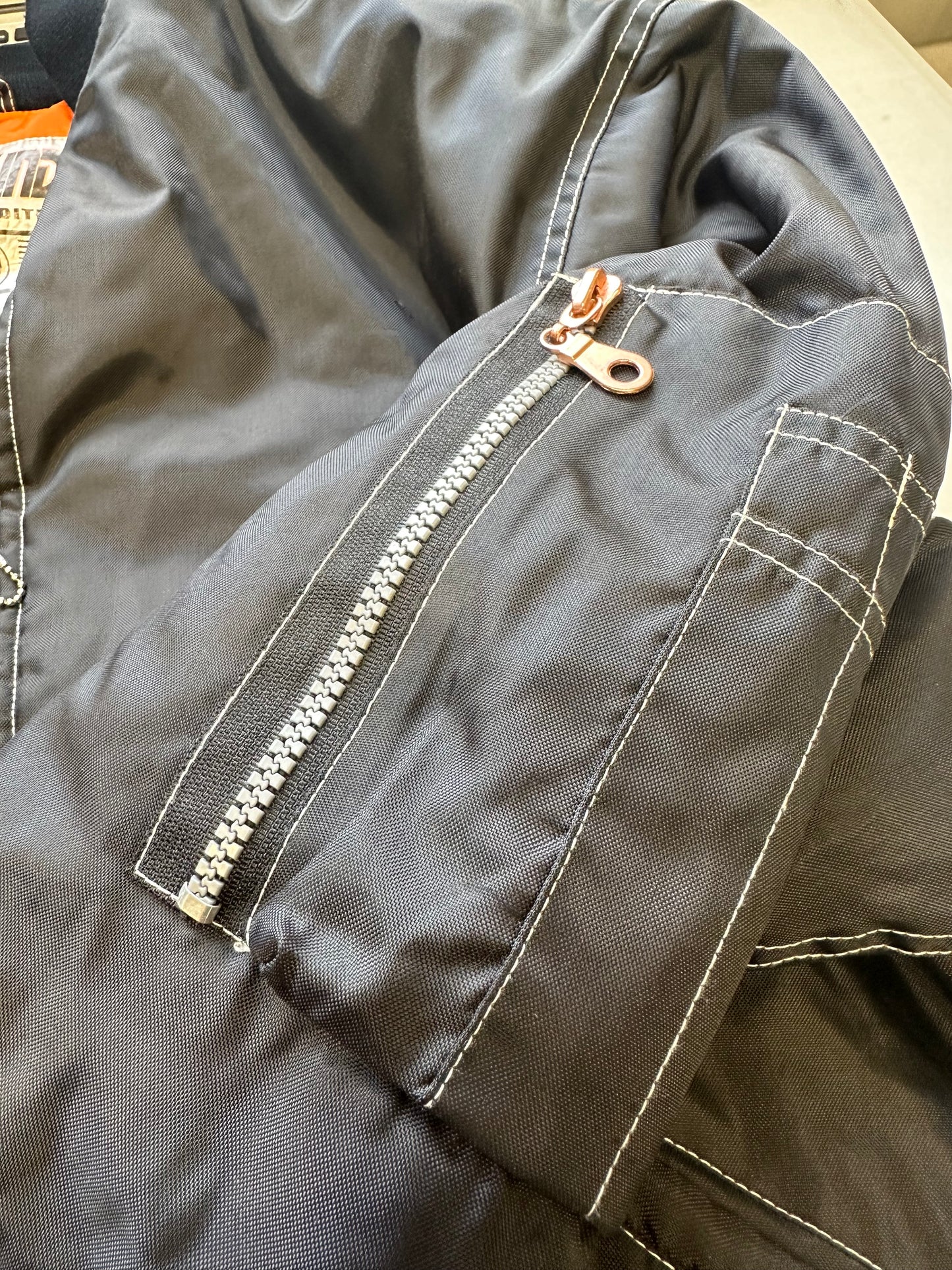 vintage black bomber with contrast stitching