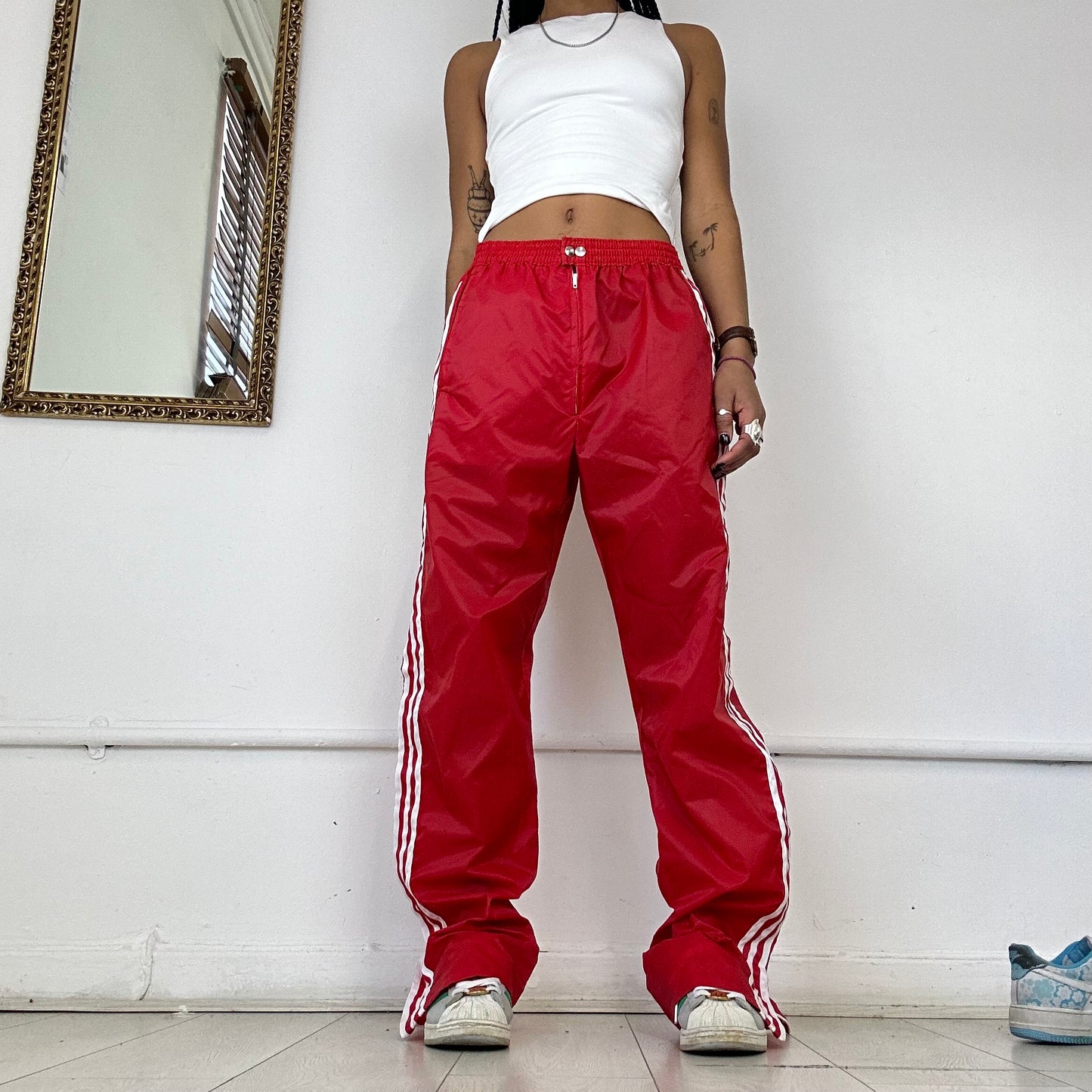 red adidas three stripe joggers