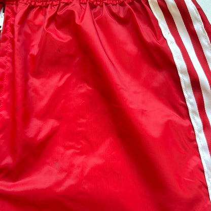 red adidas three stripe joggers