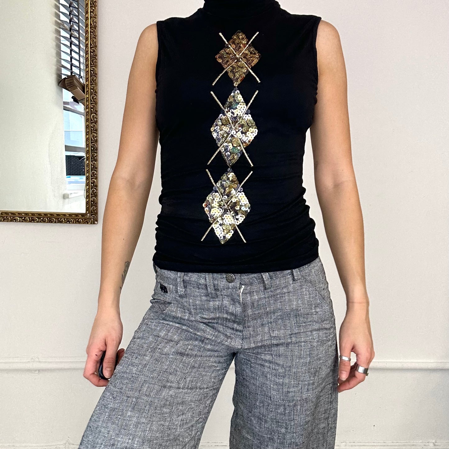 black sequined turtle neck top