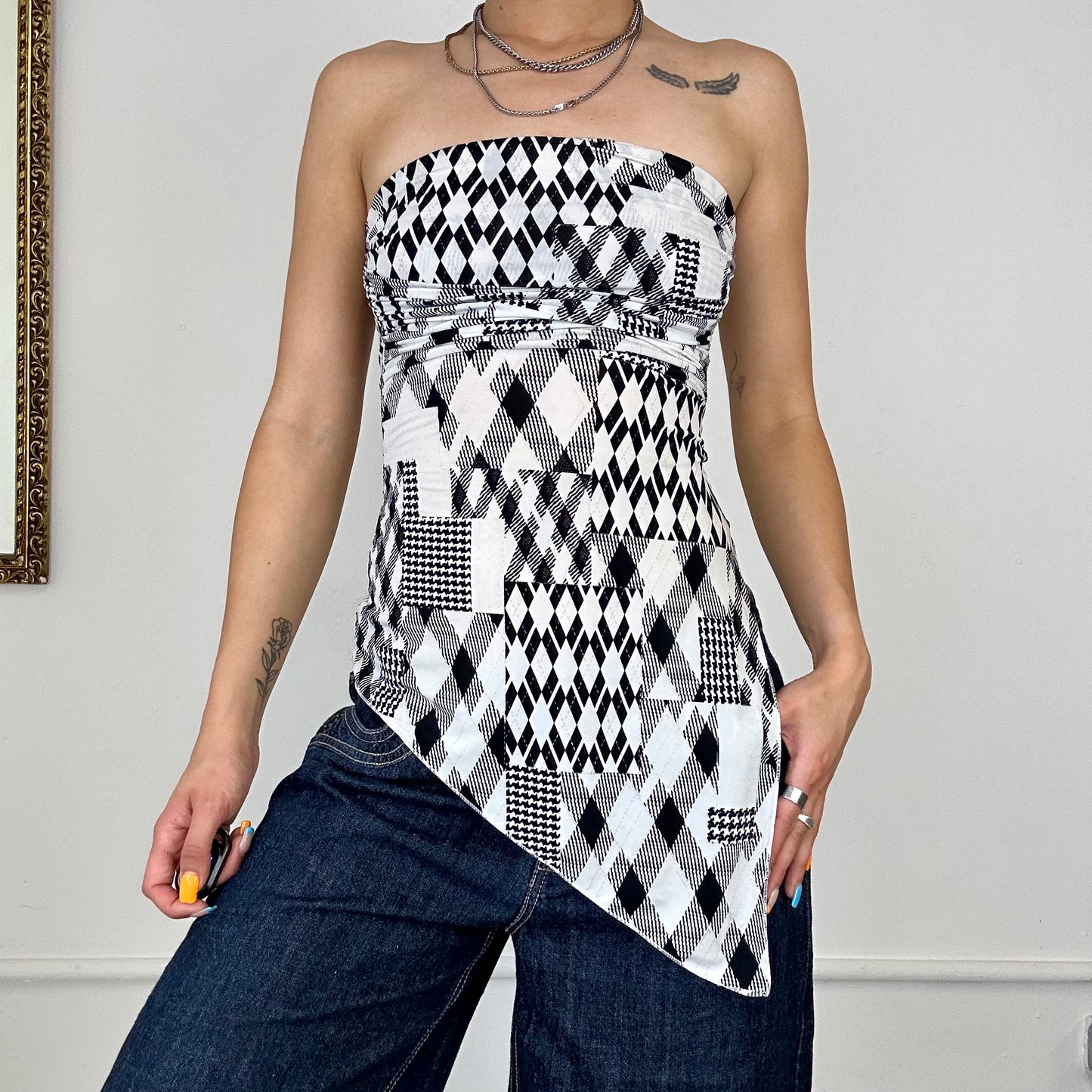 Asymmetric black and white patterned top