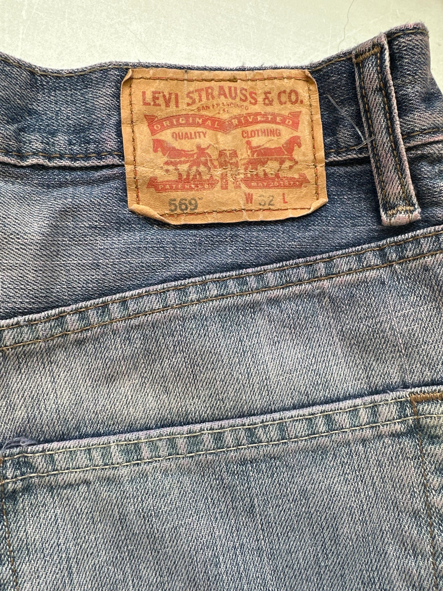 dusty pink toned levi's denim jorts