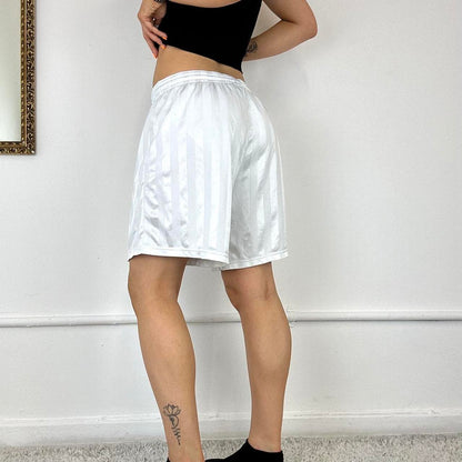 baggy white Nike track shorts