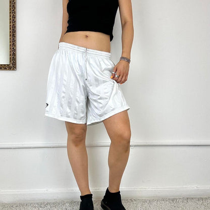 baggy white Nike track shorts