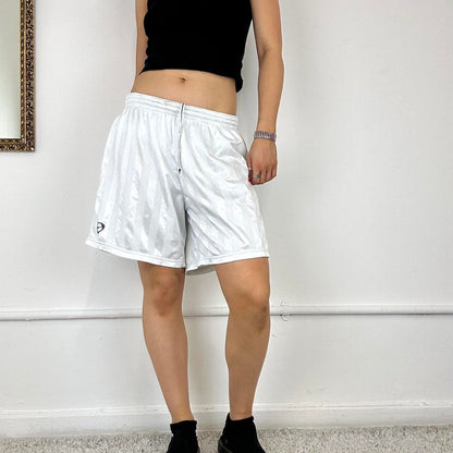 baggy white Nike track shorts