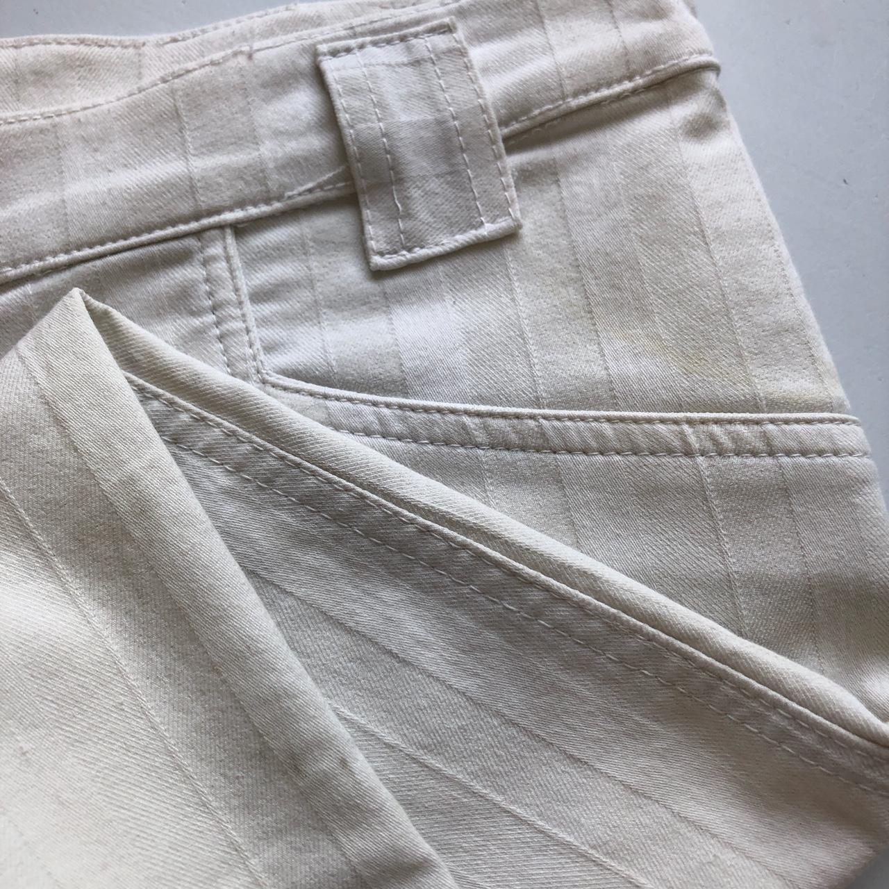 white flared pinstripe trousers